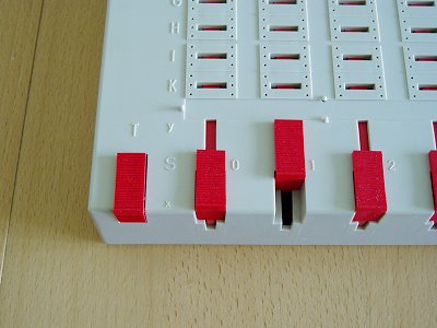 Taster (T) und Schaltschieber (S)